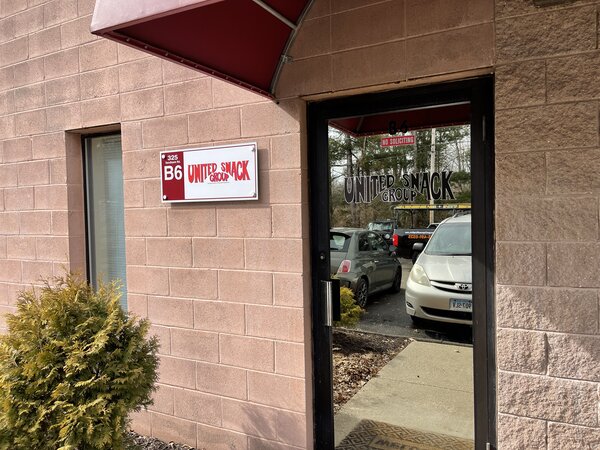 Metal sign of United Snack Group installed by Paragon Signs and Graphics in Connecticut