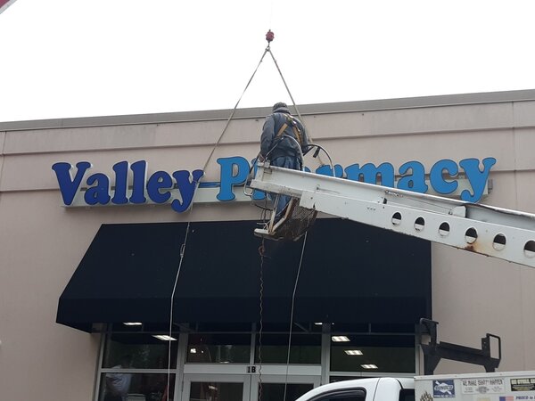 Paragon Signs and Graphics experts installing channel letters in Connecticut