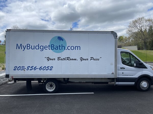 Commercial graphics on My budget bath vehicle Installed by Paragon Signs & Graphics