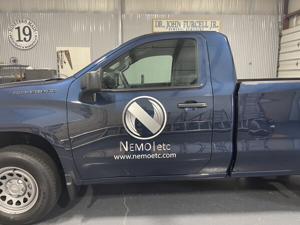 Custom logo graphics on pickup truck installed by Paragon Signs & Graphics in Connecticut