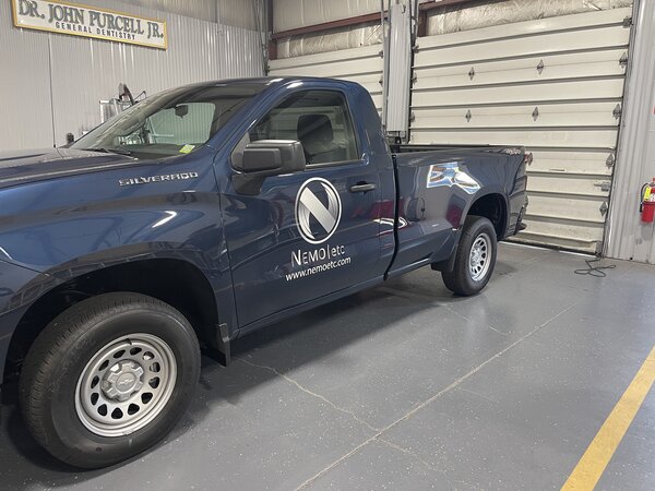 Logo graphics on Pickup truck made by Paragon Signs & Graphics in Connecticut