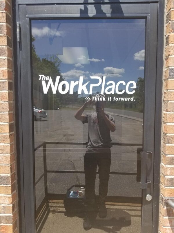 Vinyl sign of workplace on door