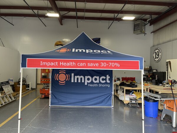 Banners of canopy tent for Impact Health Sharing