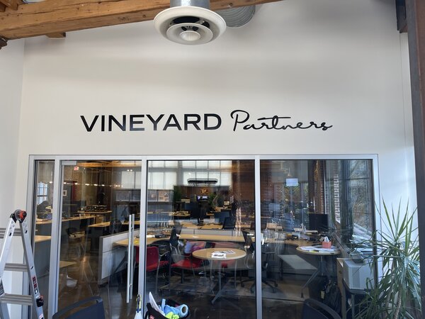 Vinyl lettering of Vineyards Partners by Paragon Signs & Graphics